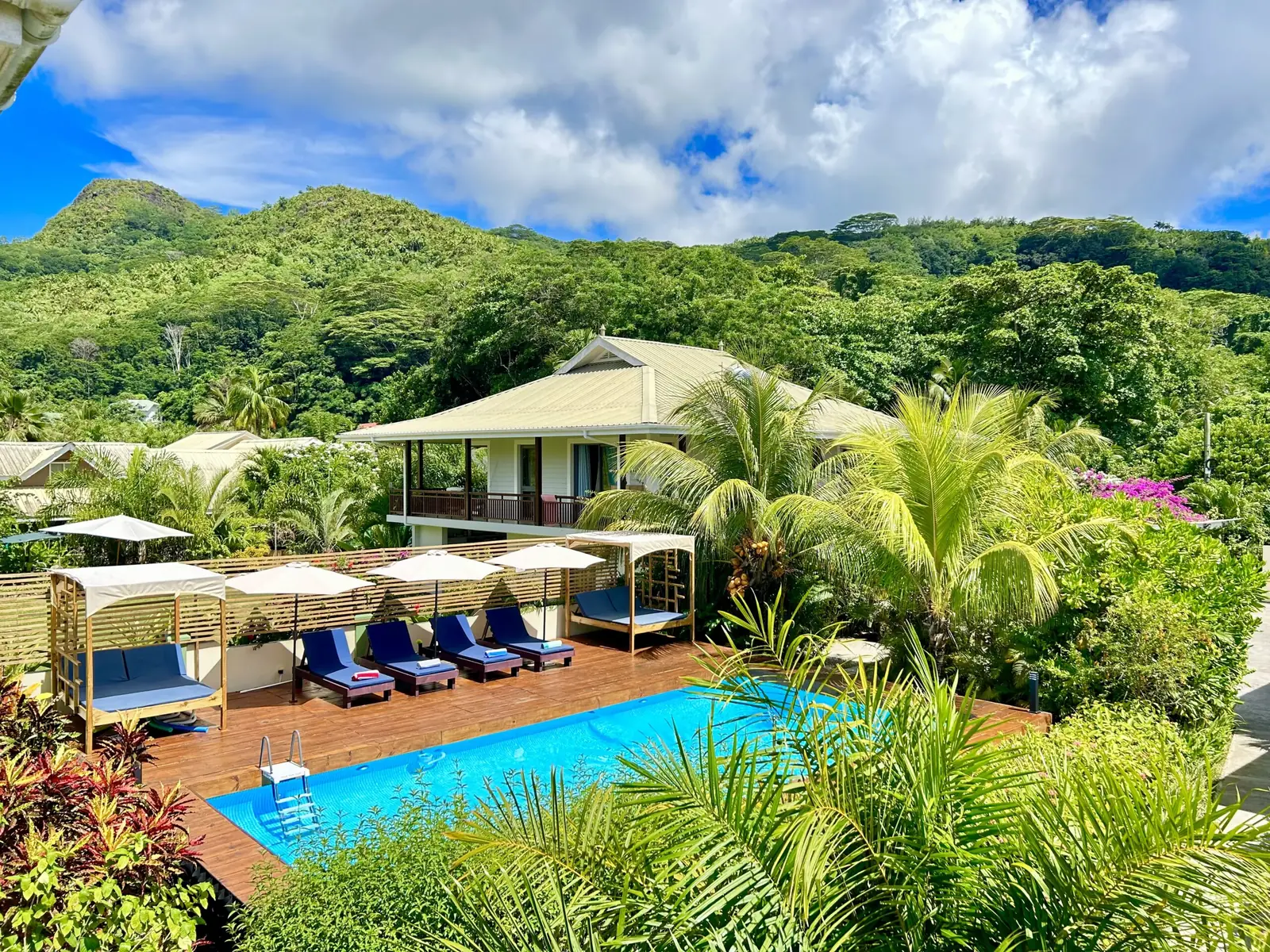 Sun loungers and parasols beside the pool